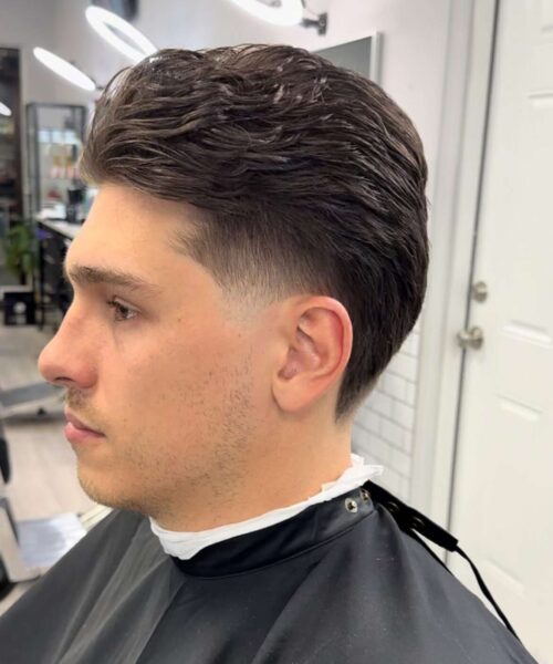 a men's haircut with scissors and clipper by Adrian